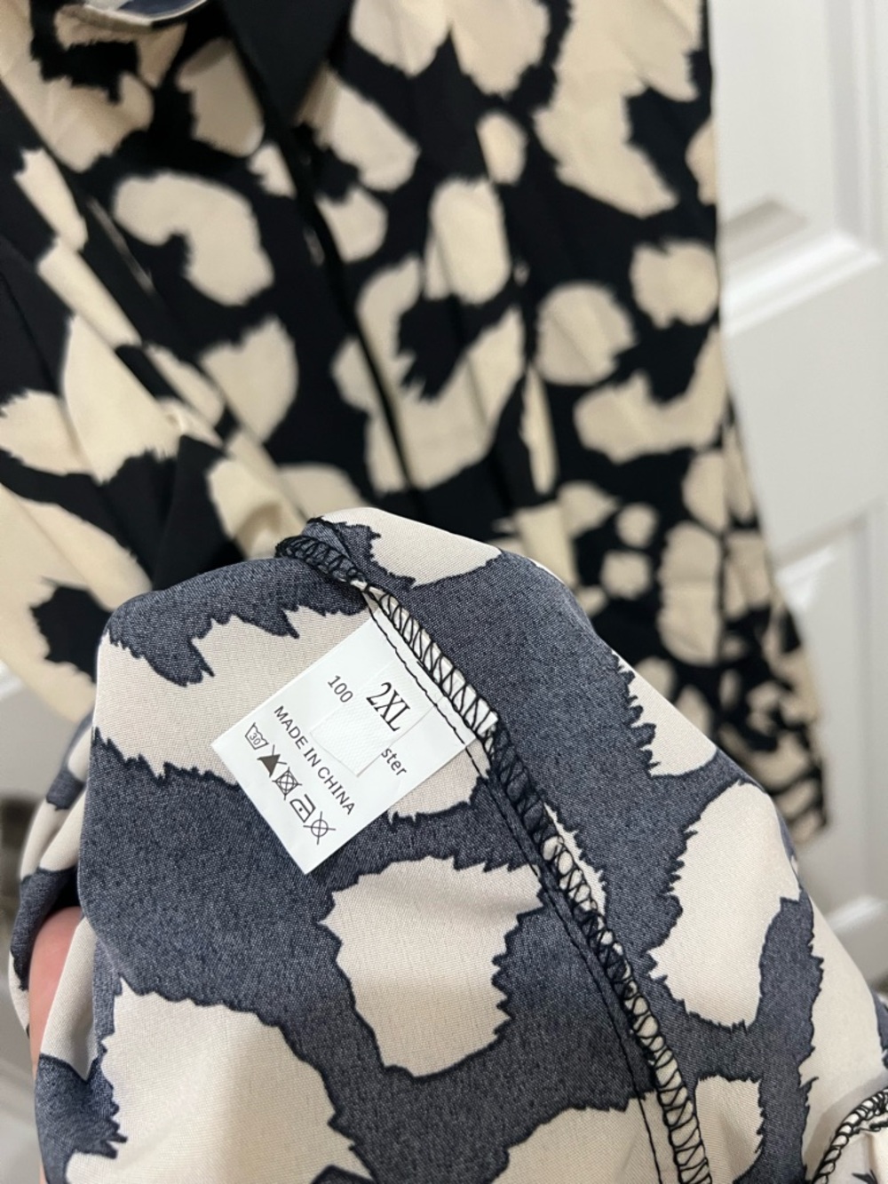 Sleeveless Black and Cream Animal Print Swing Dress - Picture 5 of 5